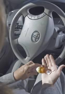 driver with pills behind the wheel